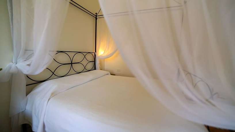 Imagen de la habitación del Hotel Villaggio Approdo Di Ulisse. Foto 7