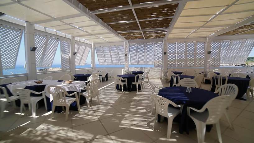 Imagen del bar/restaurante del Hotel Villaggio Approdo Di Ulisse. Foto 5