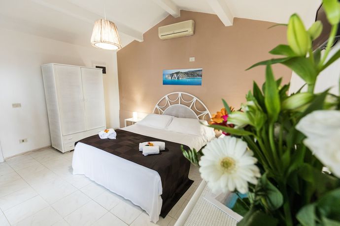 Imagen de la habitación del Hotel Villaggio Baia D'ercole. Foto 7