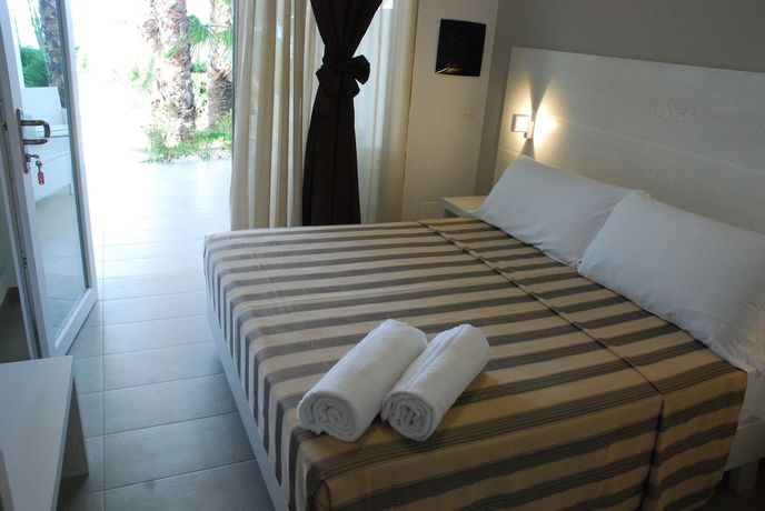 Imagen de la habitación del Hotel Villaggio Baia D'ercole. Foto 9