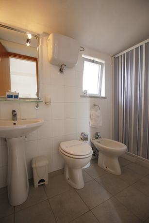 Imagen de la habitación del Hotel Villaggio Baia D'ercole. Foto 10