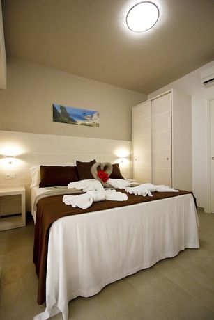 Imagen de la habitación del Hotel Villaggio Baia D'ercole. Foto 12