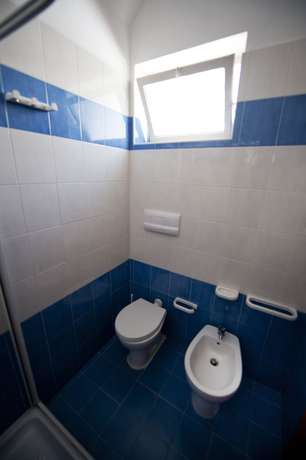 Imagen de la habitación del Hotel Villaggio Capo Vieste Camping. Foto 8