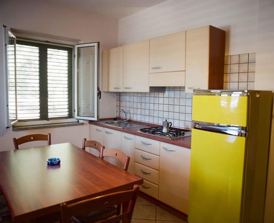 Imagen de la habitación del Hotel Villaggio Pineta Petto Bianco, Ricadi. Foto 3
