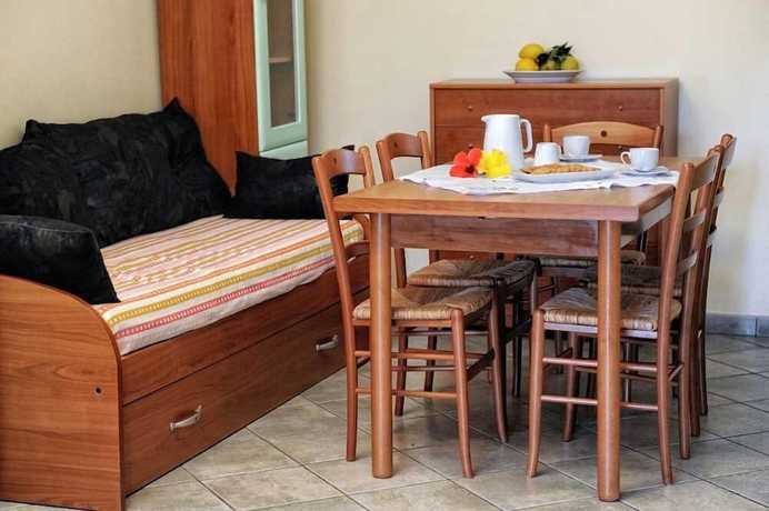 Imagen de la habitación del Hotel Villaggio Pineta Petto Bianco, Ricadi. Foto 7