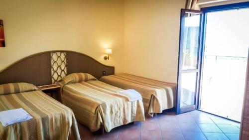 Imagen de la habitación del Hotel Villaggio Porto Rhoca. Foto 16