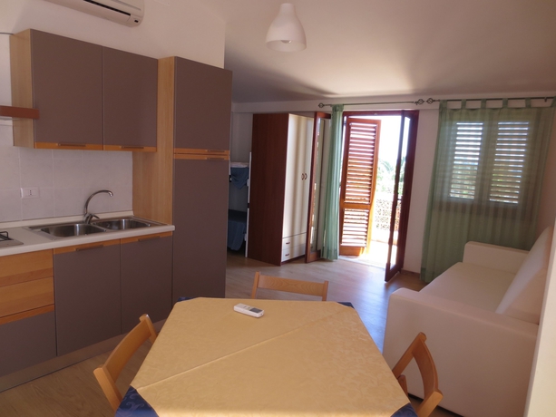 Imagen de la habitación del Hotel Villaggio Residence Testa Di Monaco. Foto 16