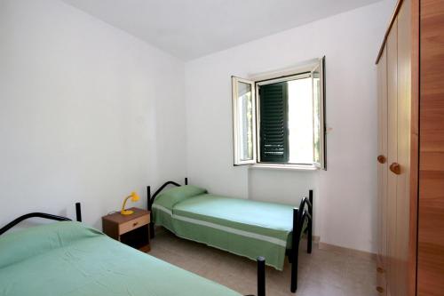 Imagen de la habitación del Hotel Villaggio Turistico Residence Delfino. Foto 20