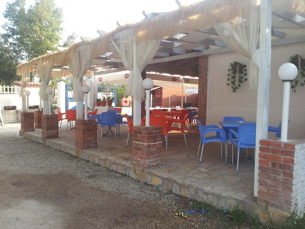 Imagen del bar/restaurante del Hotel Villaggio shehu. Foto 7