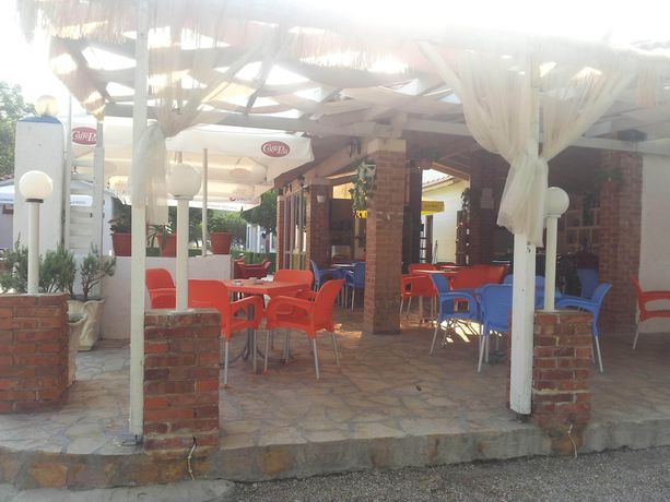 Imagen del bar/restaurante del Hotel Villaggio shehu. Foto 11