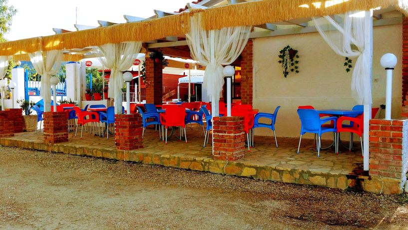 Imagen del bar/restaurante del Hotel Villaggio shehu. Foto 13