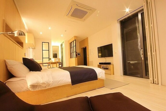 Imagen de la habitación del Hotel Villanoi Jeju. Foto 19