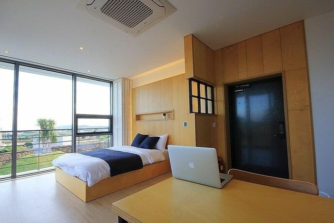 Imagen de la habitación del Hotel Villanoi Jeju. Foto 36