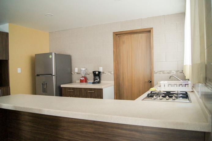 Imagen de la habitación del Hotel Villas Analco Apartments. Foto 9