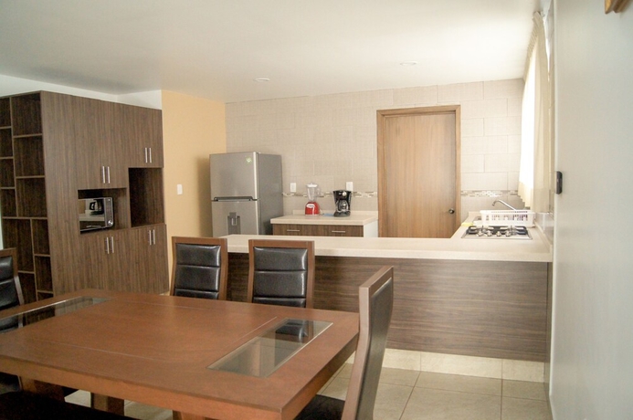 Imagen de la habitación del Hotel Villas Analco Apartments. Foto 10