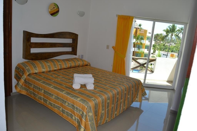 Imagen de la habitación del Hotel Villas Coco Mango. Foto 3