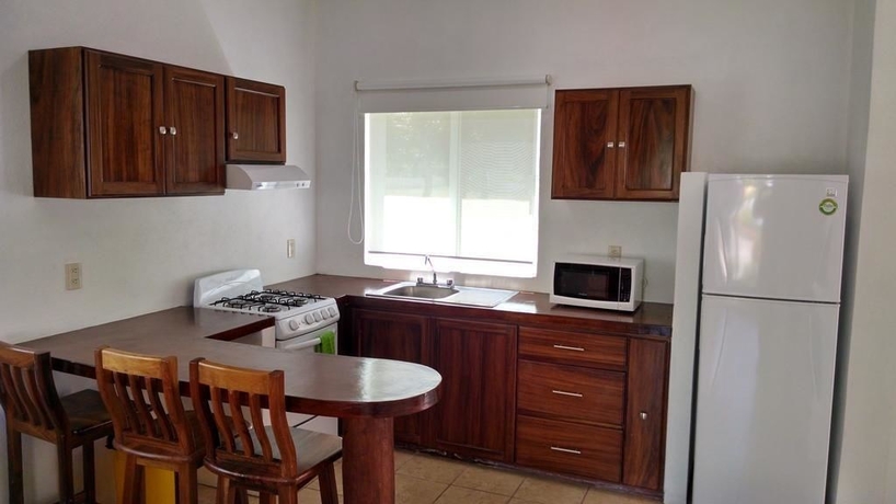 Imagen de la habitación del Hotel Villas Coco Mango. Foto 11