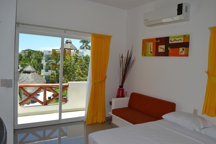 Imagen de la habitación del Hotel Villas Coco Mango. Foto 13