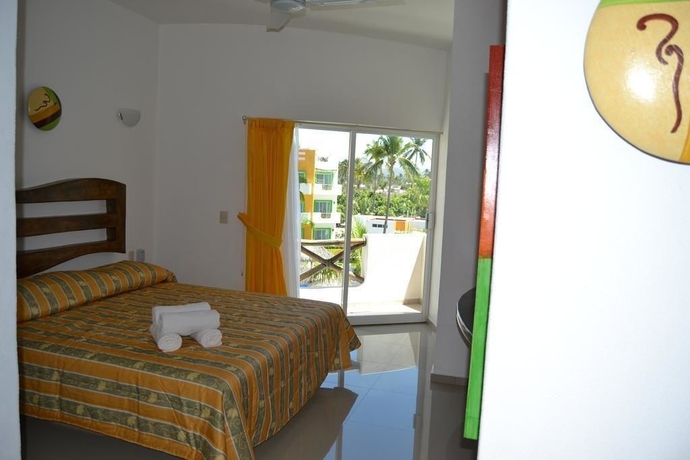 Imagen de la habitación del Hotel Villas Coco Mango. Foto 14