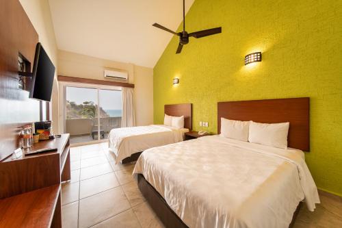 Imagen de la habitación del Hotel Villas Coral Huatulco. Foto 19