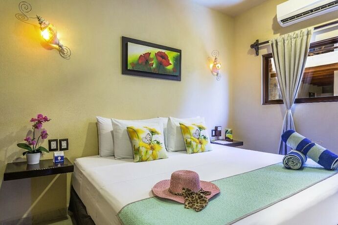 Imagen de la habitación del Hotel Villas El Jardín. Foto 9