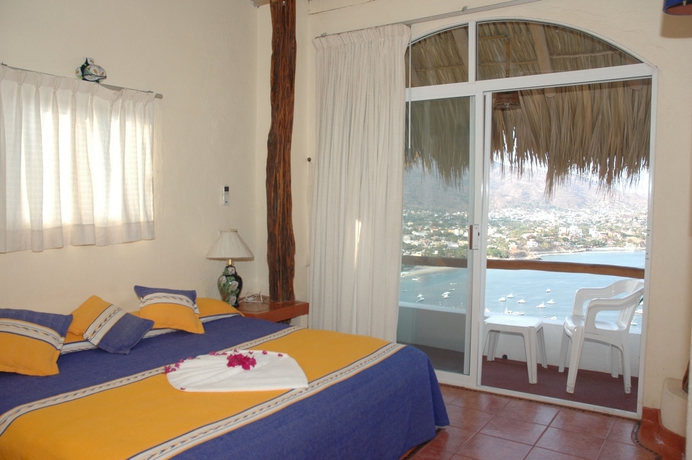 Imagen de la habitación del Hotel Villas El Morro. Foto 13