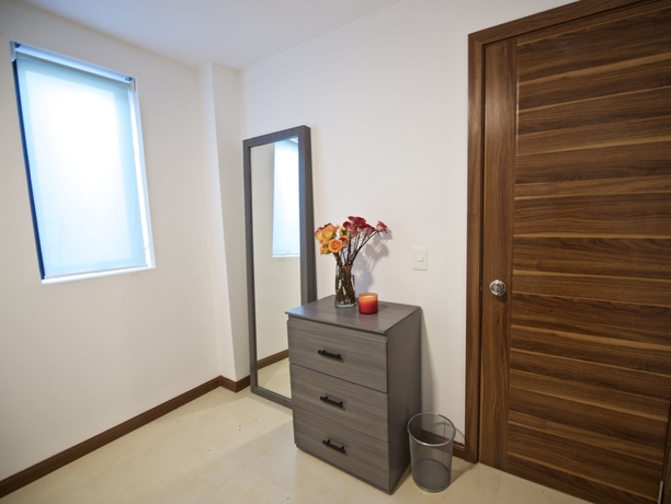 Imagen de la habitación del Hotel Villas Grand Gardenia. Foto 11