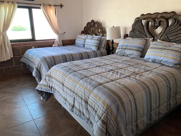 Imagen de la habitación del Hotel Villas Mahando. Foto 11