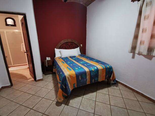 Imagen de la habitación del Hotel Villas Vista Suites. Foto 17