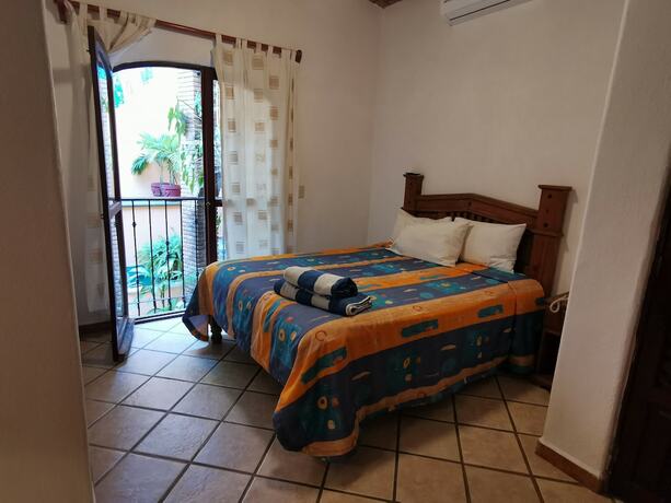 Imagen de la habitación del Hotel Villas Vista Suites. Foto 19