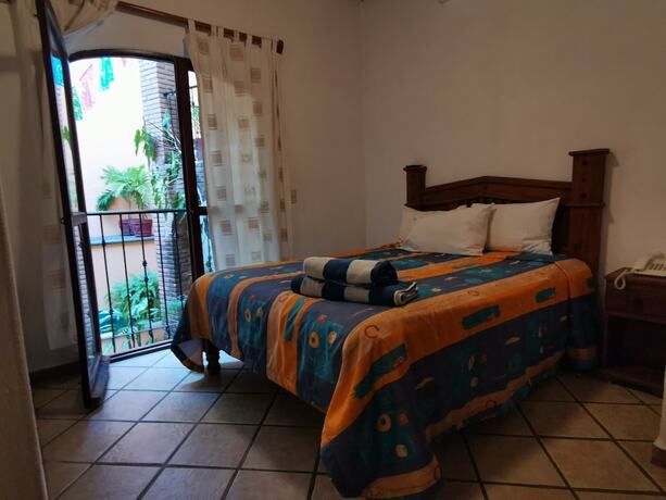 Imagen de la habitación del Hotel Villas Vista Suites. Foto 20