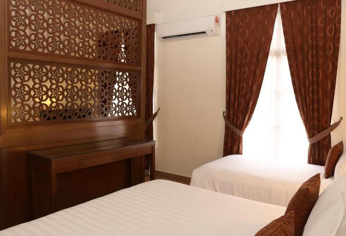 Imagen de la habitación del Hotel Villea Morib. Foto 16