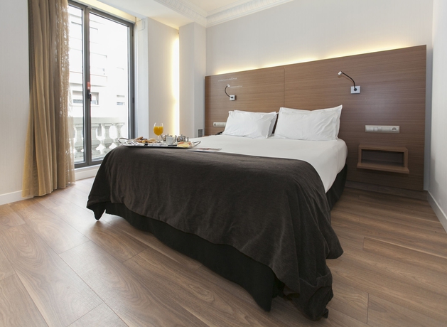 Imagen de la habitación del Hotel Vincci Zentro Zaragoza. Foto 8