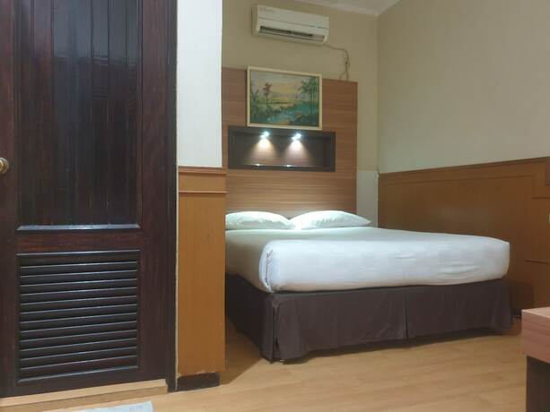 Imagen de la habitación del Hotel Violand Garden Samarinda. Foto 17