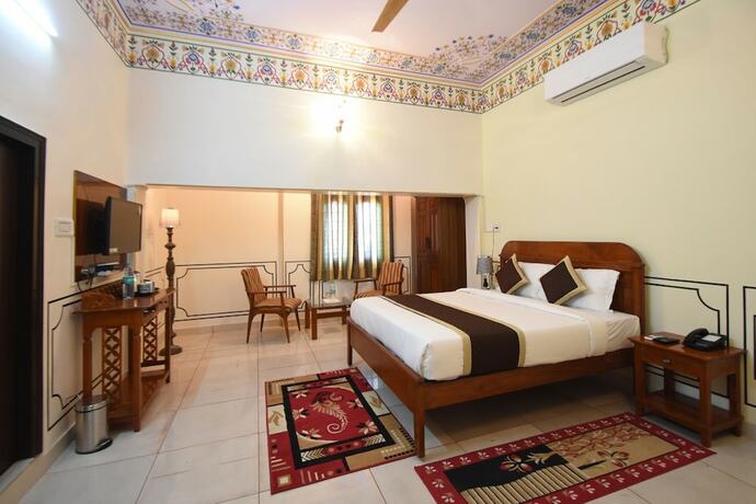 Imagen de la habitación del Hotel Virasat Mahal Heritage. Foto 17