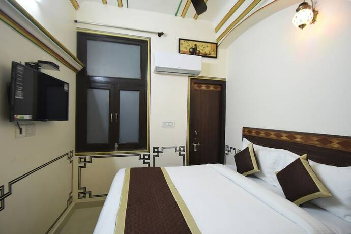 Imagen de la habitación del Hotel Virasat Mahal Heritage. Foto 19