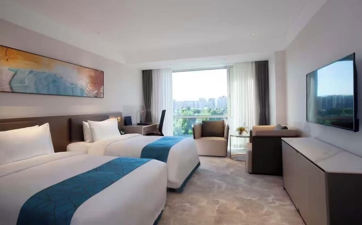 Imagen de la habitación del Hotel Vision Plaza Shahe Intl. Cultural Center. Foto 6