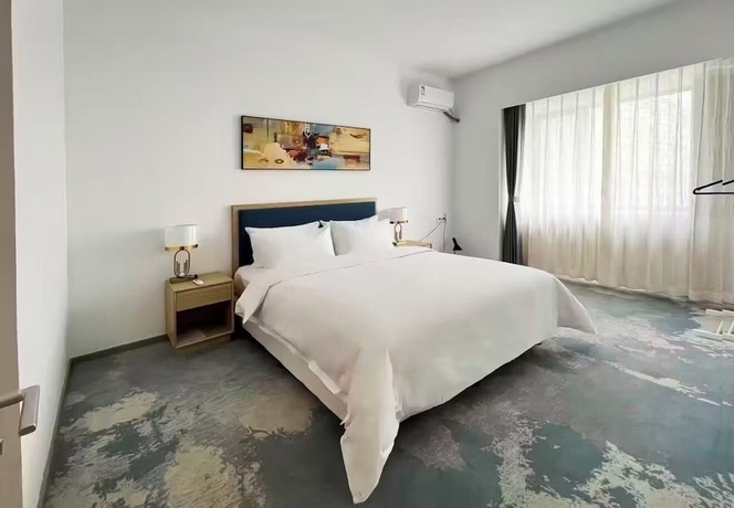 Imagen de la habitación del Hotel Vision Plaza Shahe Intl. Cultural Center. Foto 13