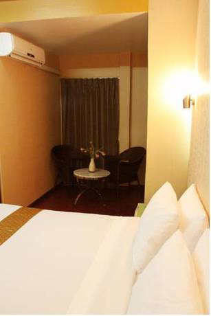 Imagen de la habitación del Hotel Visiting Card and Resort. Foto 6