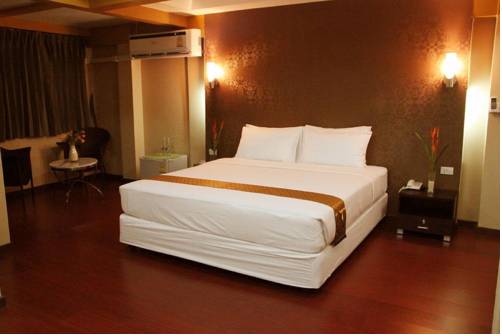 Imagen de la habitación del Hotel Visiting Card and Resort. Foto 9