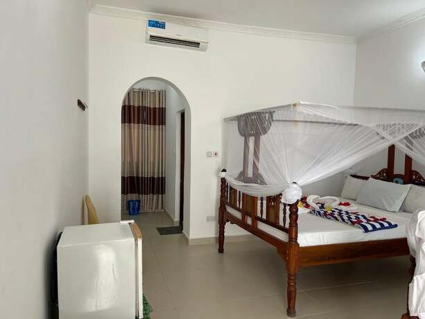 Imagen de la habitación del Hotel Visitors Inn Jambiani. Foto 6