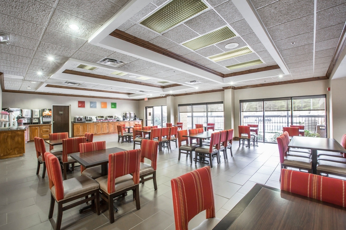 Imagen del bar/restaurante del Hotel Vista Suites Near Island and Leconte Convention Center. Foto 3