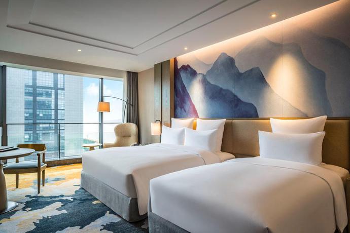 Imagen de la habitación del Hotel Vistas al mar Pullman Zhoushan. Foto 19