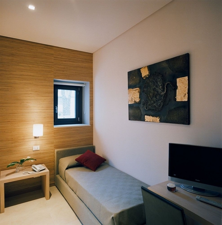 Imagen de la habitación del Hotel Vittorio Veneto. Foto 9