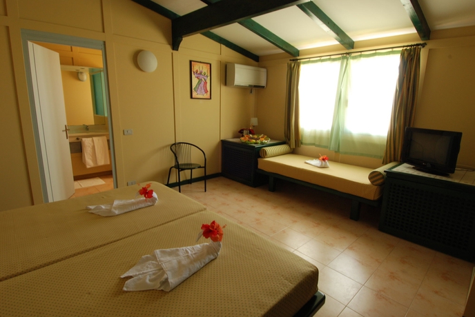 Imagen de la habitación del Hotel Voi Vila Do Farol Resort. Foto 9