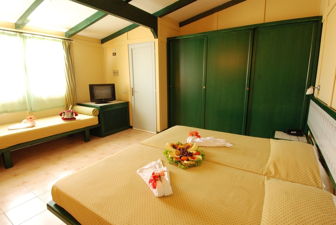 Imagen de la habitación del Hotel Voi Vila Do Farol Resort. Foto 10