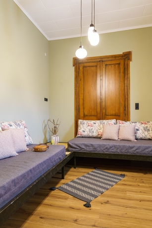 Imagen de la habitación del Hotel Voulamandis House. Foto 9