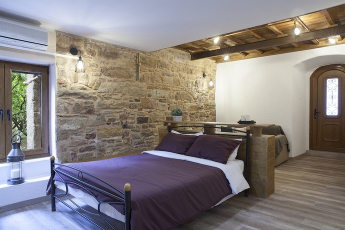 Imagen de la habitación del Hotel Voulamandis House. Foto 15