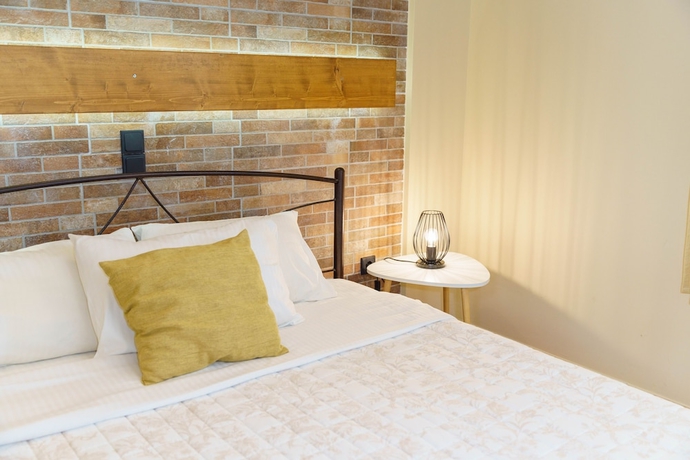Imagen de la habitación del Hotel Voulamandis House. Foto 17