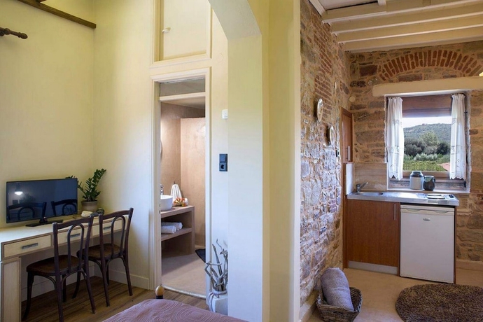 Imagen de la habitación del Hotel Voulamandis House. Foto 19
